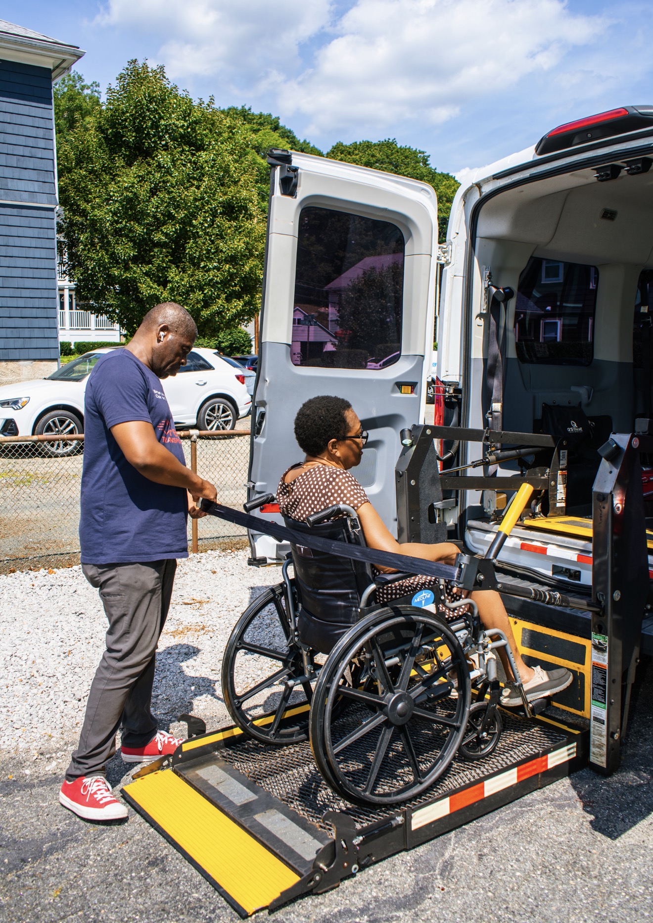 FedNor driver loading a wheelchair passenger into the van